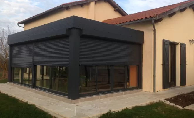Installation de véranda avec volet roulant dans le Tarn-et-Garonne par ALU PROJECT